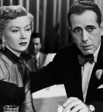 A man and woman dressed in formal wear